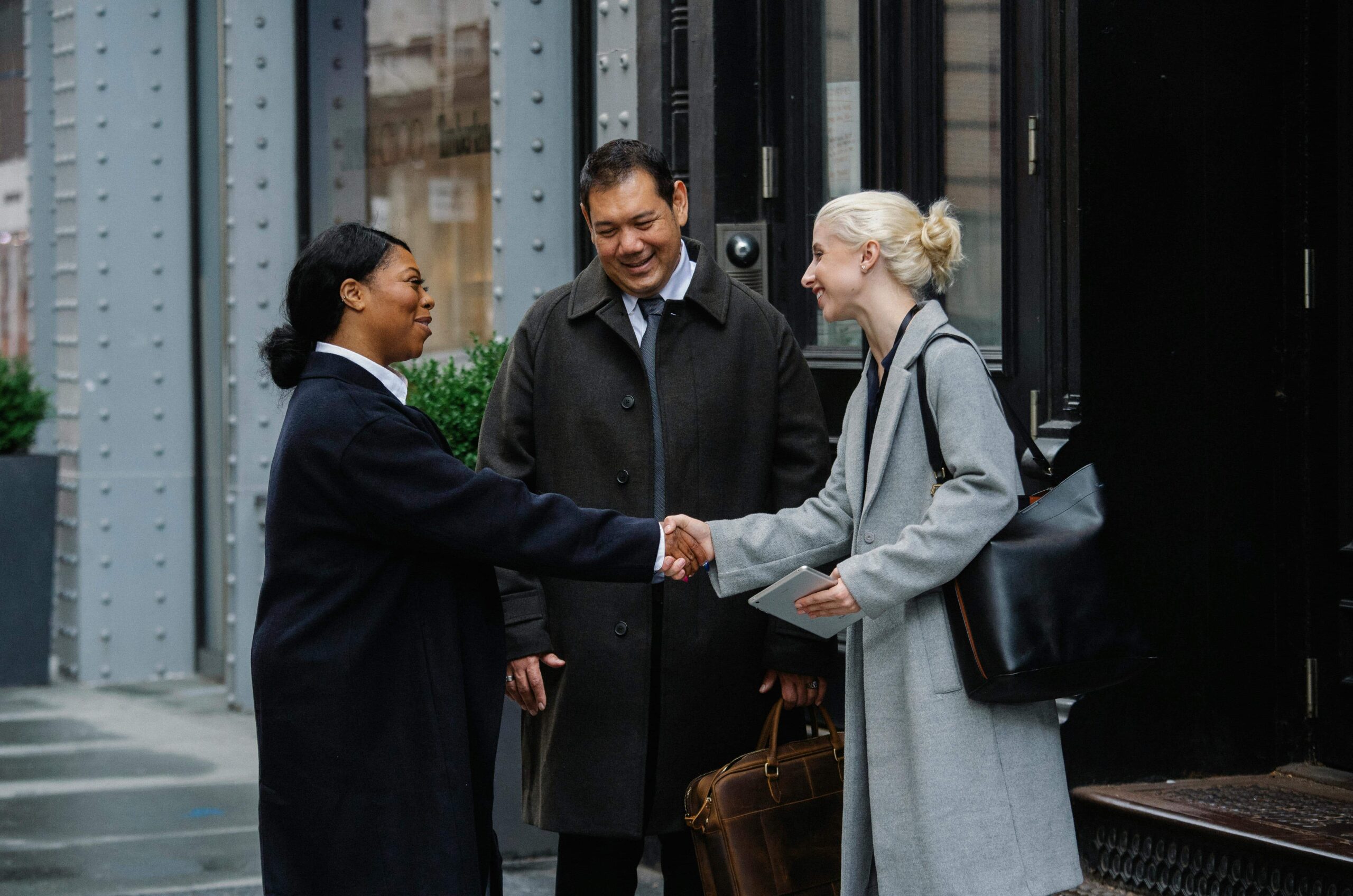 Friend intrucing his wife, with one esthetician enthusiastically explaining her services — a casual moment showing “How Do I Introduce Myself as an Esthetiacian.”