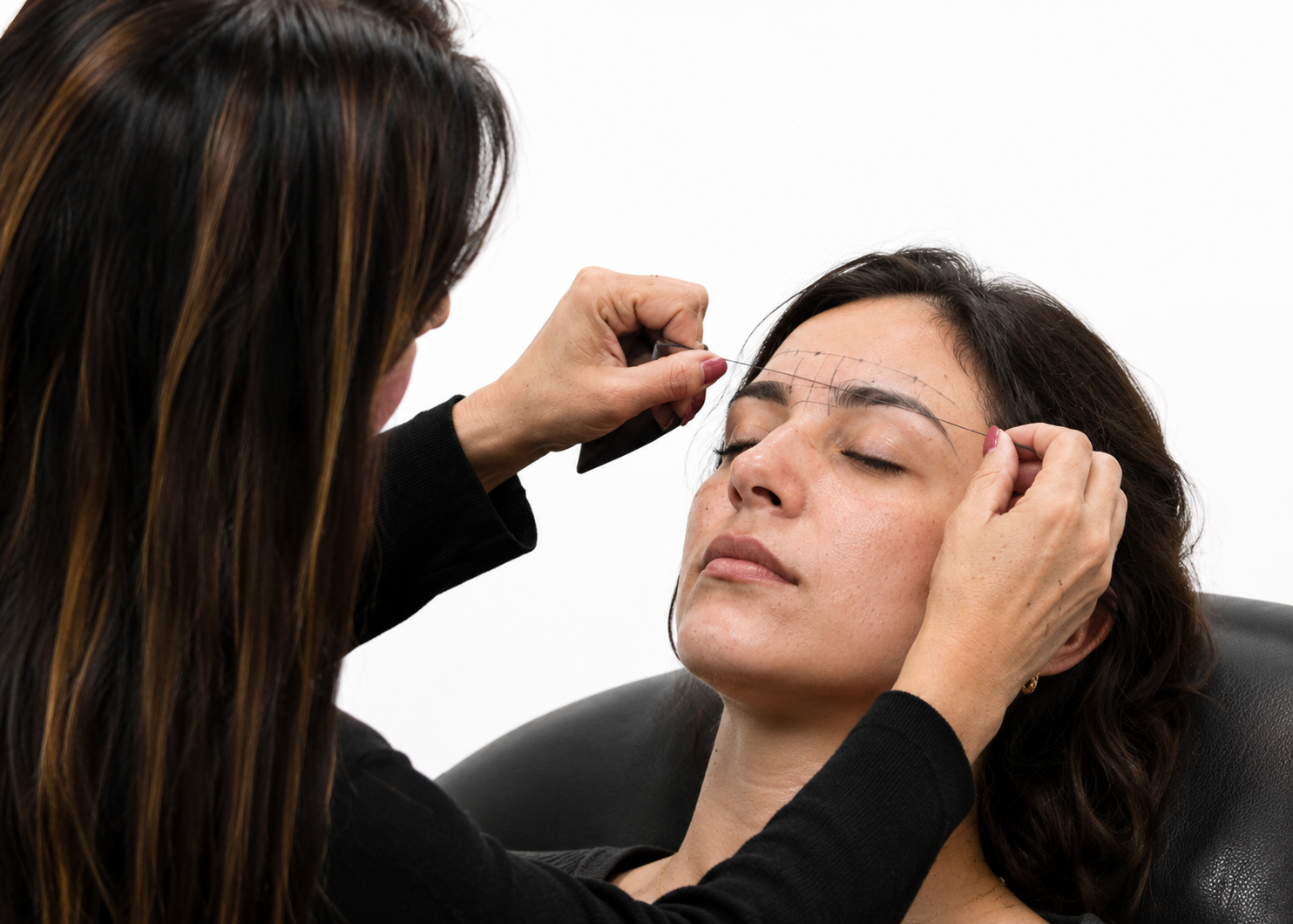 Student apply brow henna dye on model